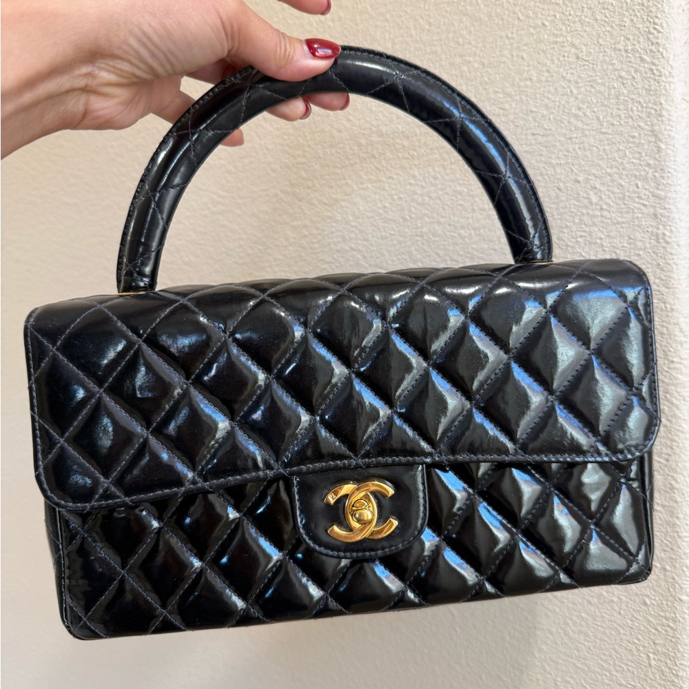 CHANEL Kelly Black Quilted Satchel with Gold Accent